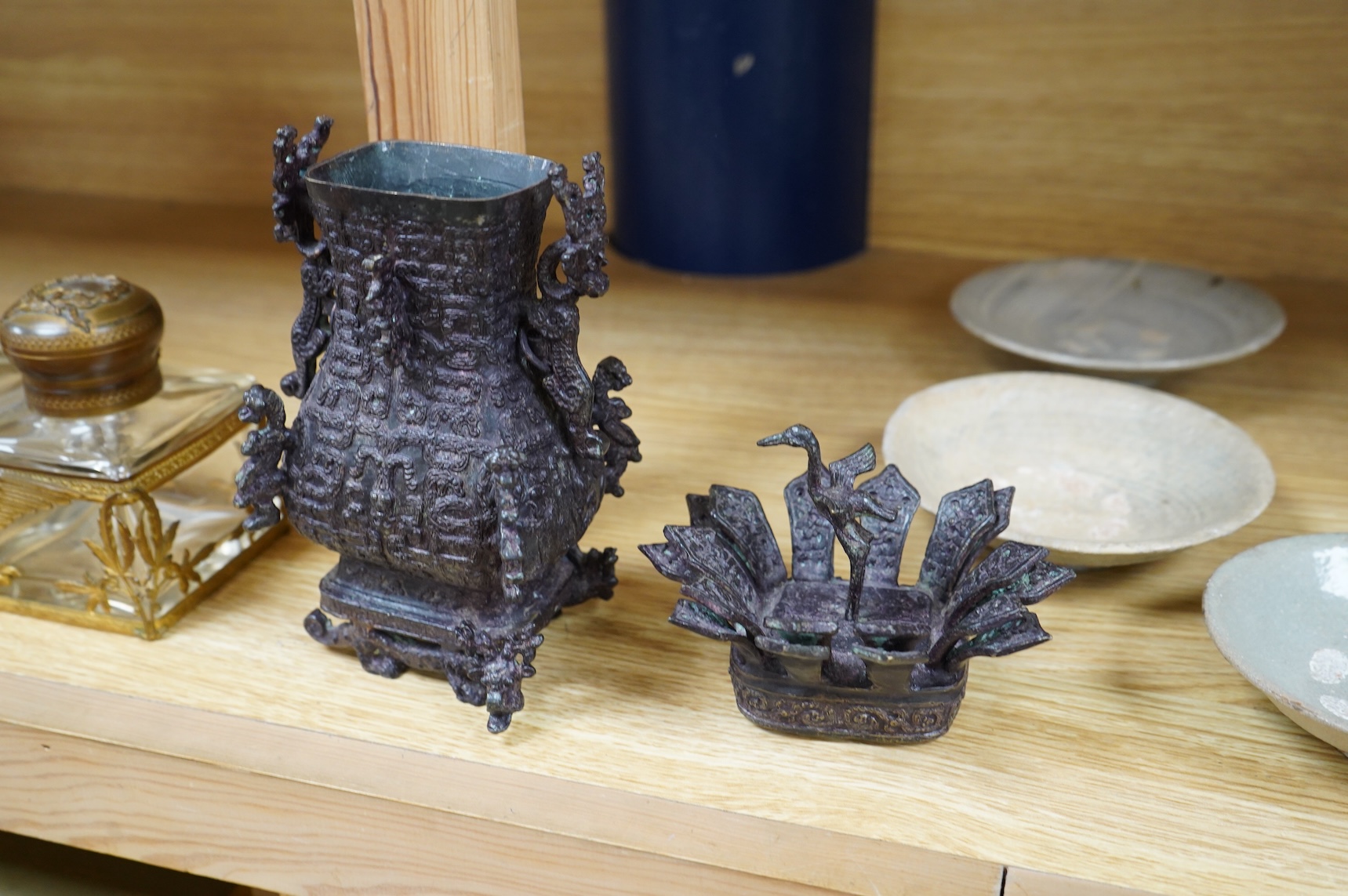 A Chinese Shang style bronze vessel and cover, 23cm